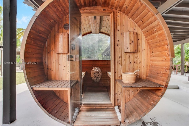 view of sauna featuring a wealth of natural light and concrete floors