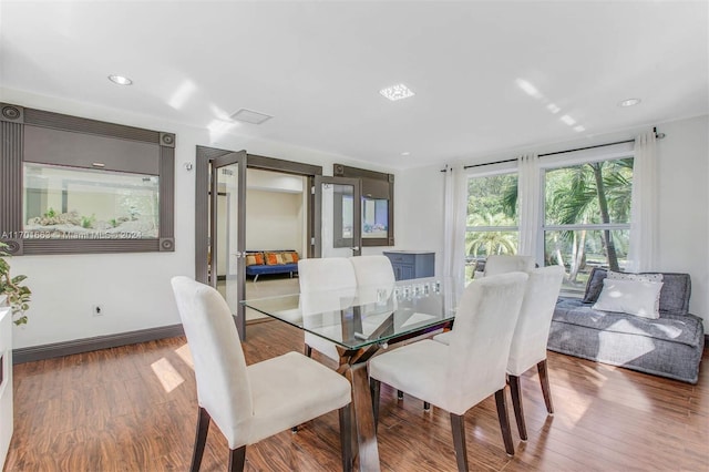 dining area featuring hardwood / wood-style floors