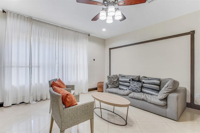 tiled living room featuring ceiling fan