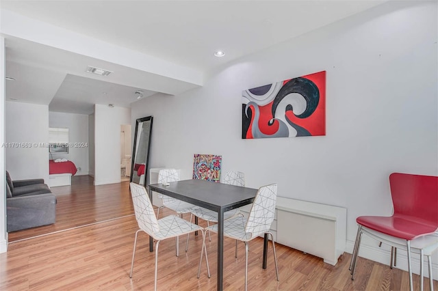 dining room with hardwood / wood-style floors