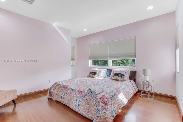 bedroom with hardwood / wood-style floors