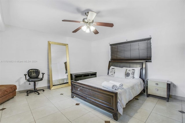 tiled bedroom with ceiling fan