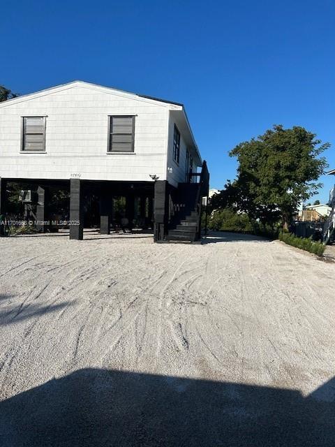 view of side of home featuring a carport