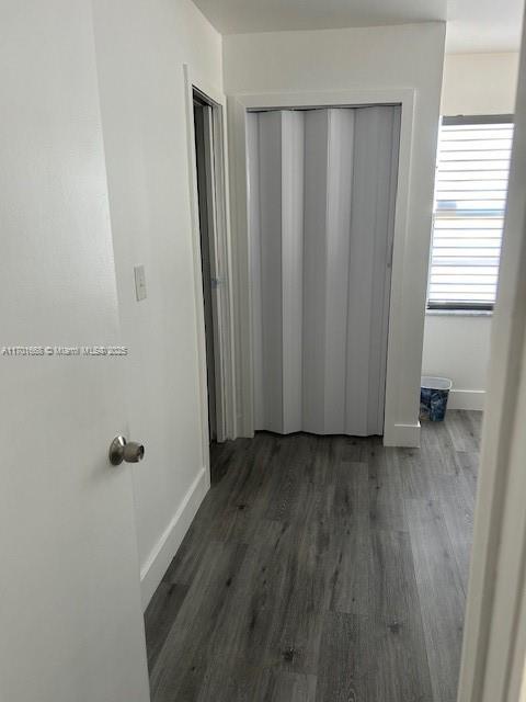 hall featuring dark wood-type flooring