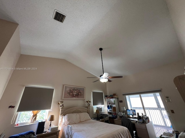 bedroom featuring a textured ceiling, access to exterior, ceiling fan, and vaulted ceiling