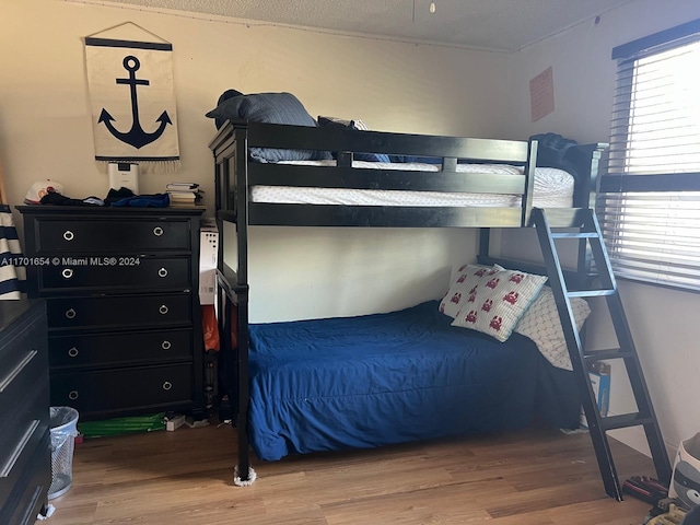 bedroom with hardwood / wood-style floors