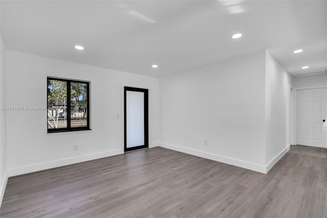 empty room featuring hardwood / wood-style floors