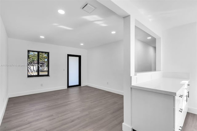 empty room featuring wood-type flooring