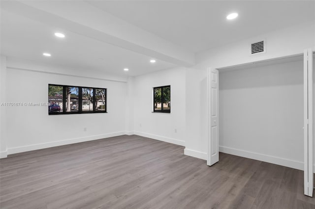 unfurnished bedroom featuring hardwood / wood-style floors