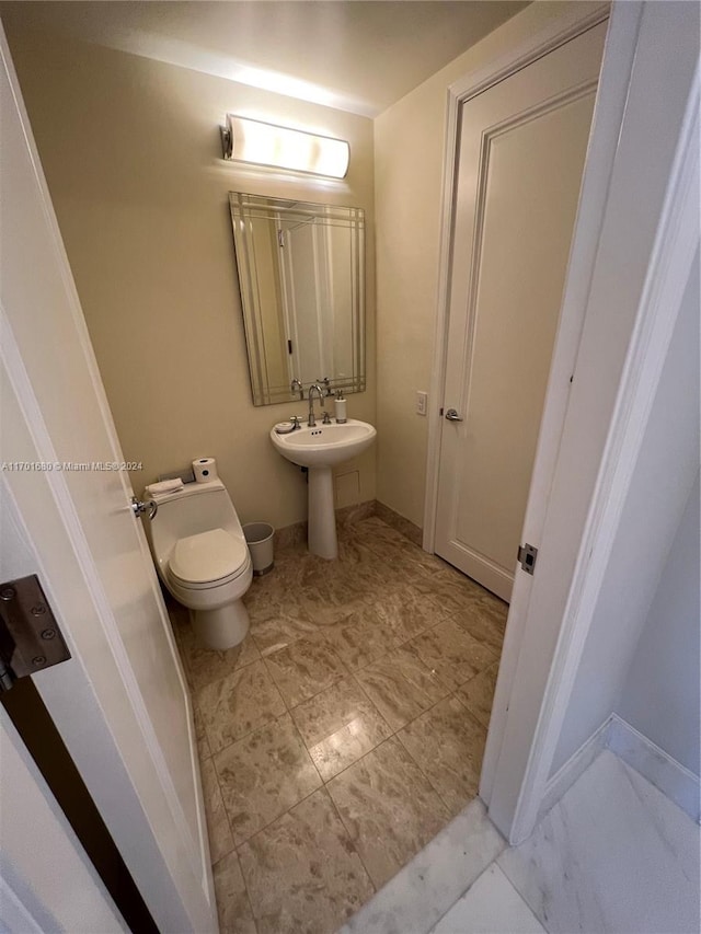 bathroom featuring toilet