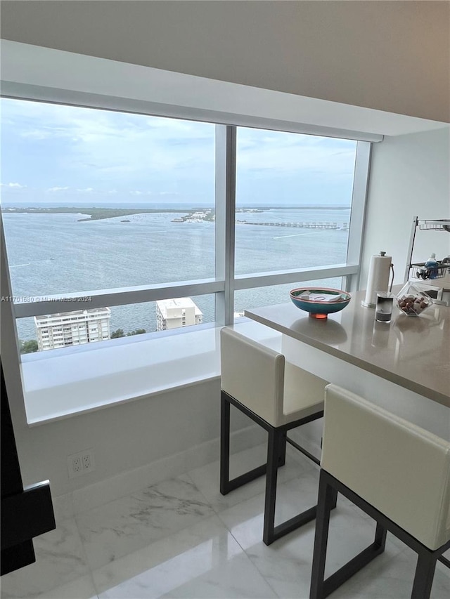 dining room featuring a water view