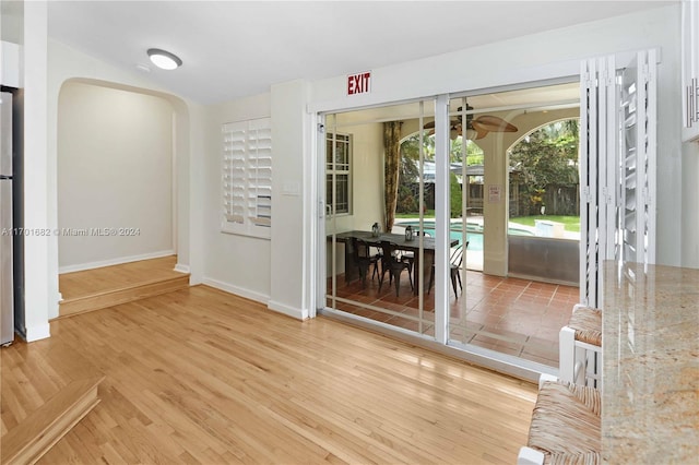 spare room with hardwood / wood-style floors and ceiling fan