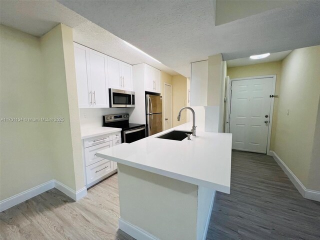 10670 SW 156th Pl Unit 304, Miami, FL 33196 - spare room with a textured ceiling, ceiling fan, a textured wall, baseboards, and dark wood-type flooring