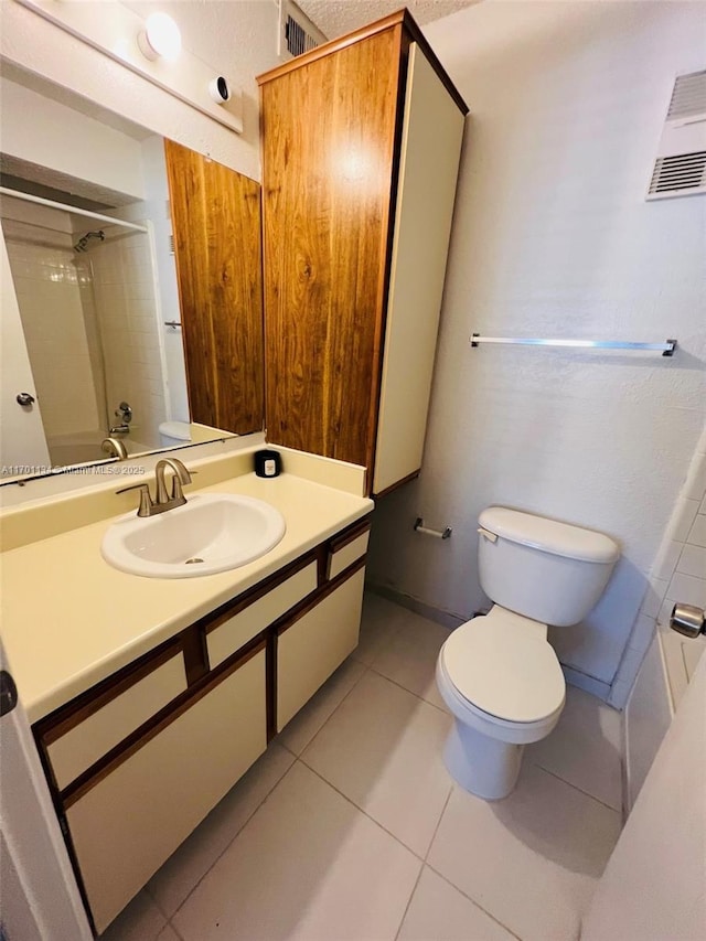 full bathroom featuring vanity, shower / tub combination, tile patterned floors, and toilet