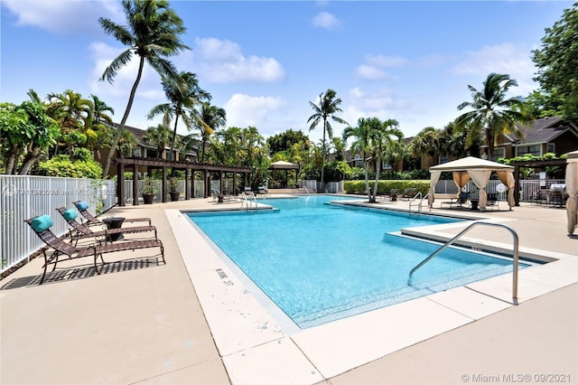 view of pool featuring a gazebo, a pergola, and a patio area