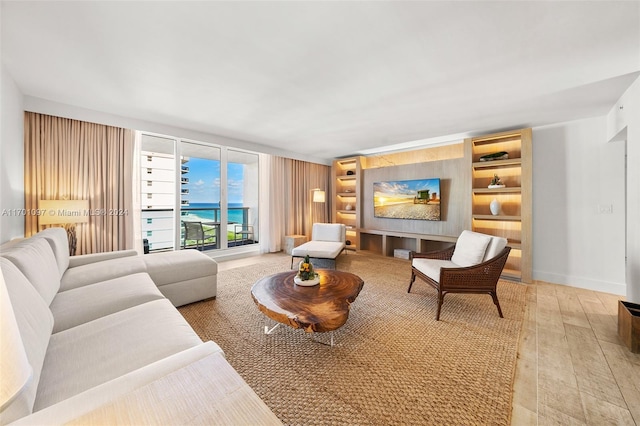 102 24th St Unit 1215, Miami Beach, FL 33139 - living area with light wood finished floors and baseboards