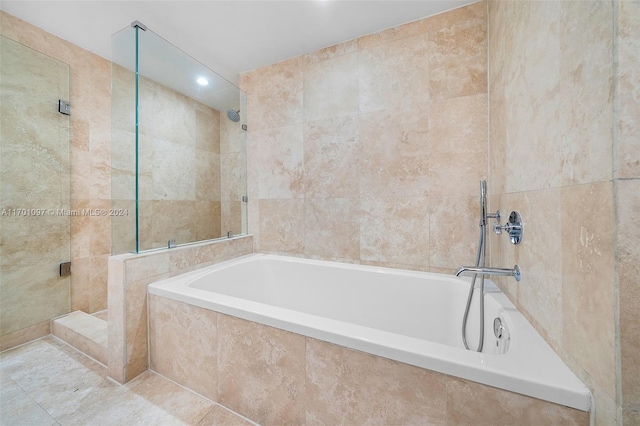 102 24th St Unit 1215, Miami Beach, FL 33139 - bathroom featuring tile walls, tiled shower, a garden tub, and recessed lighting