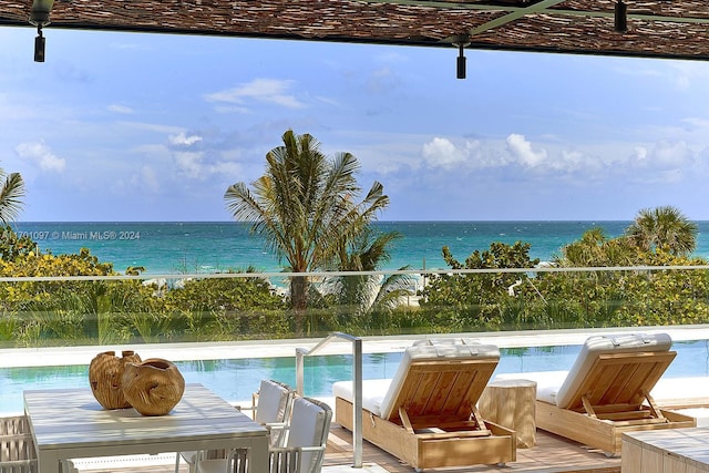 view of pool featuring a water view