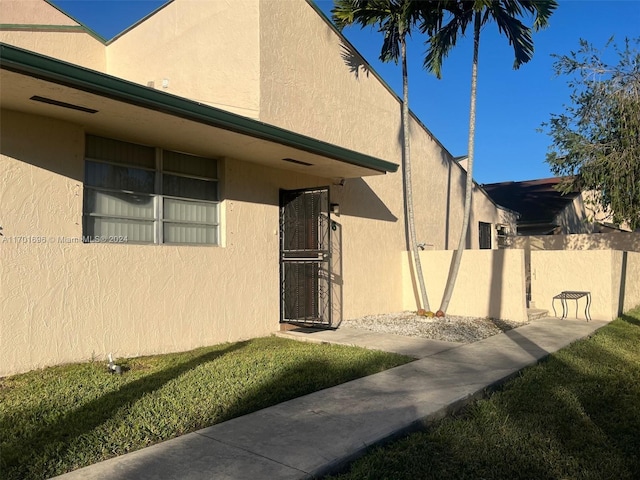 view of side of property with a yard