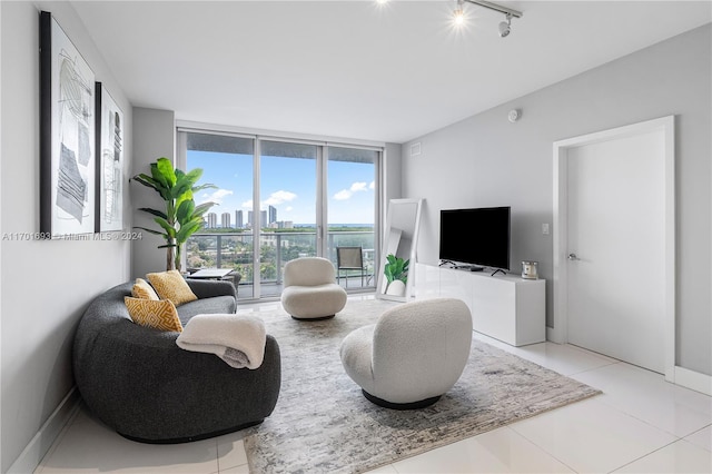 living room featuring light tile patterned floors and track lighting