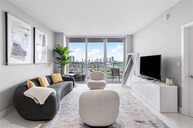 living room featuring floor to ceiling windows