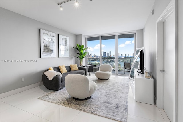 tiled living room with floor to ceiling windows and track lighting