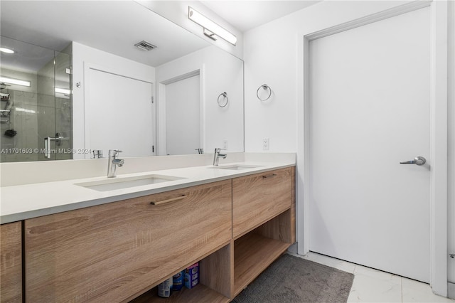 bathroom featuring vanity and an enclosed shower