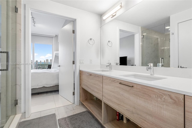 bathroom with vanity and a shower with door