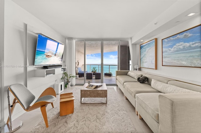 living room featuring floor to ceiling windows