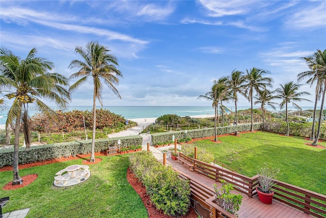 view of yard featuring a beach view and a water view