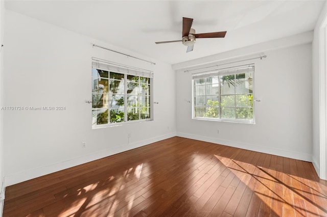 empty room featuring ceiling fan and wood-type flooring