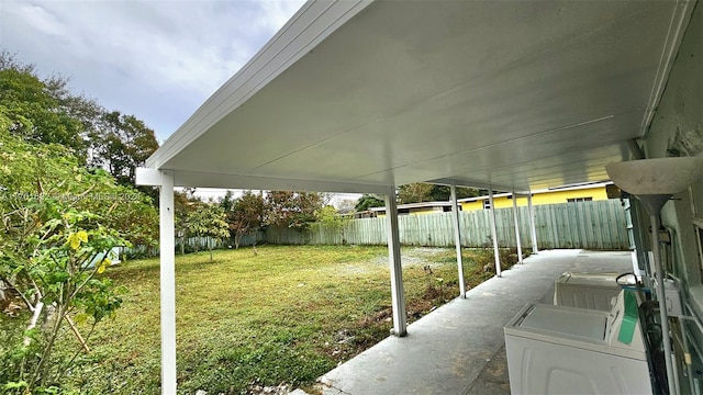 view of yard with washing machine and clothes dryer