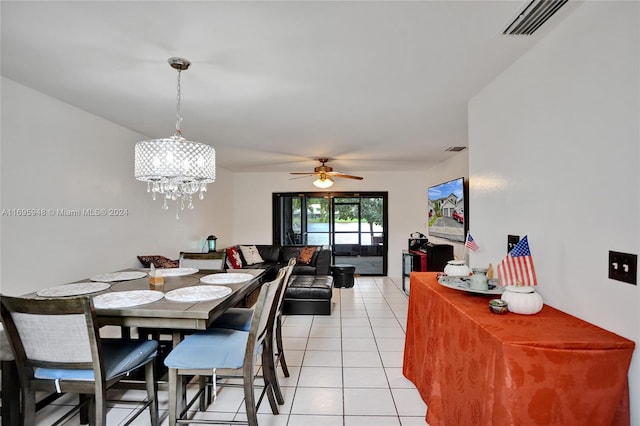 tiled dining room featuring ceiling fan