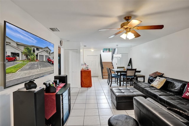 tiled living room featuring ceiling fan