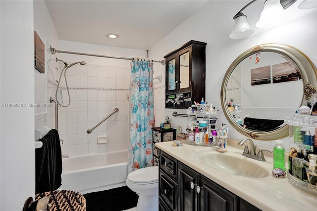 full bathroom with shower / bath combo, vanity, and toilet