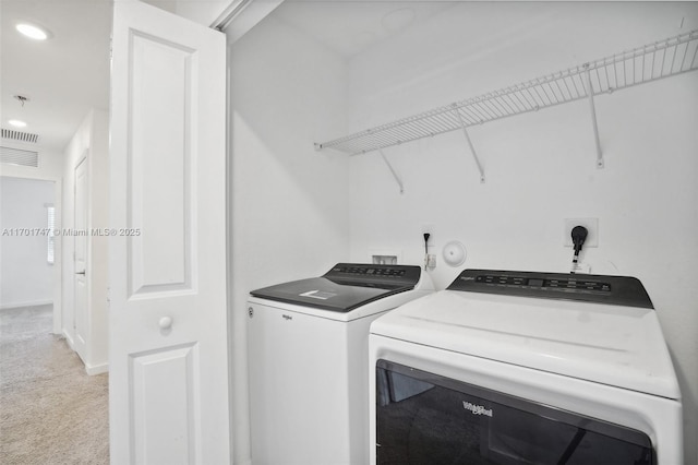 laundry room featuring washer and dryer and carpet flooring