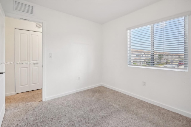 view of carpeted spare room