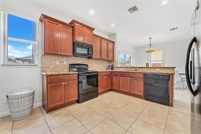 kitchen with black appliances, sink, hanging light fixtures, decorative backsplash, and light tile patterned floors