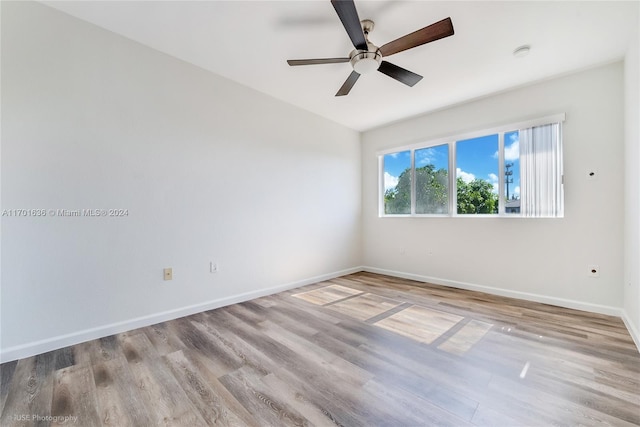 spare room featuring ceiling fan and light hardwood / wood-style floors