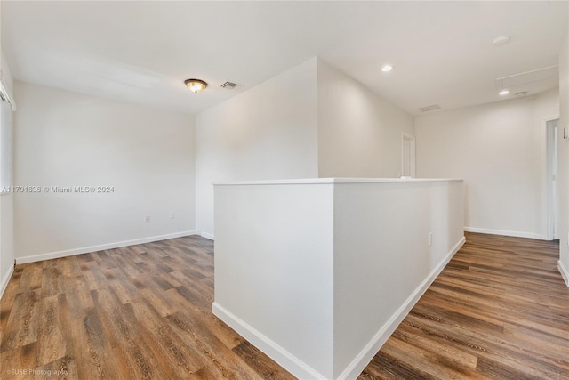 hallway featuring dark hardwood / wood-style floors