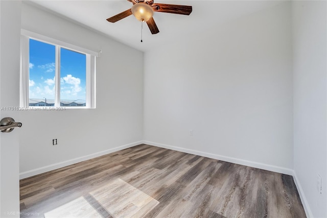 empty room with light wood-type flooring and ceiling fan