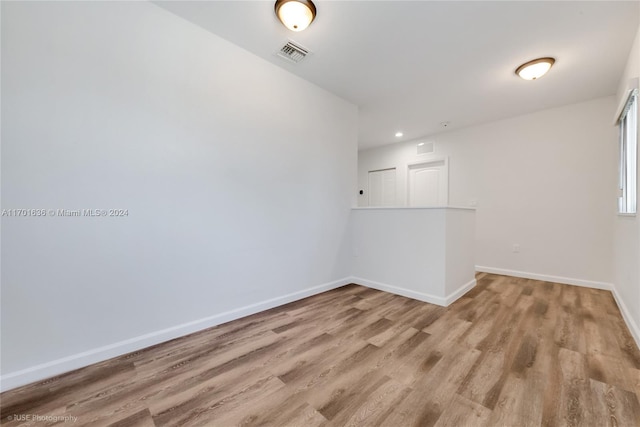 spare room featuring light wood-type flooring