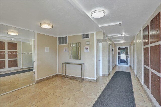 corridor featuring light tile patterned flooring