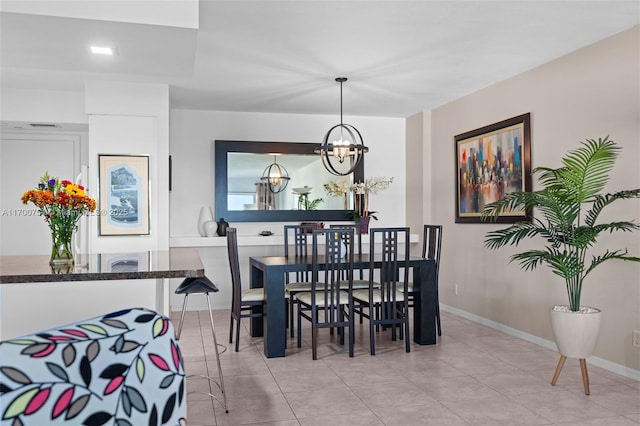 tiled dining area with a notable chandelier