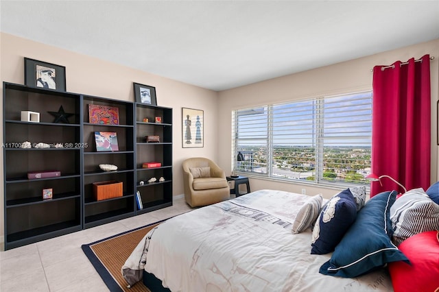 bedroom featuring light tile patterned floors