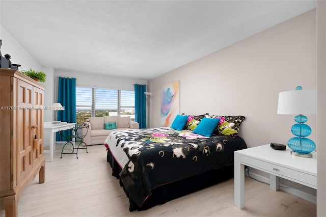 bedroom with light hardwood / wood-style flooring