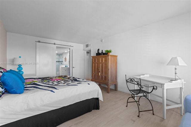 bedroom with light hardwood / wood-style flooring