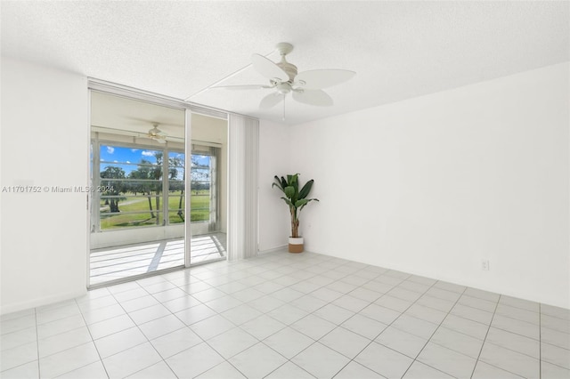 unfurnished room with light tile patterned floors, a textured ceiling, and ceiling fan