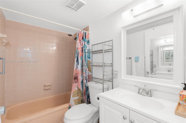 full bathroom with vanity, toilet, and shower / bath combo with shower curtain