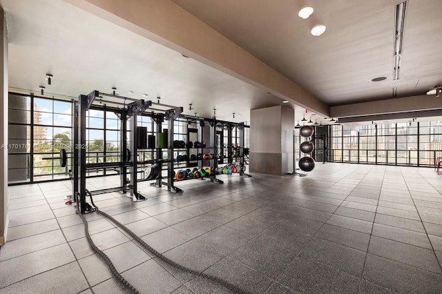 gym with a wall of windows and plenty of natural light